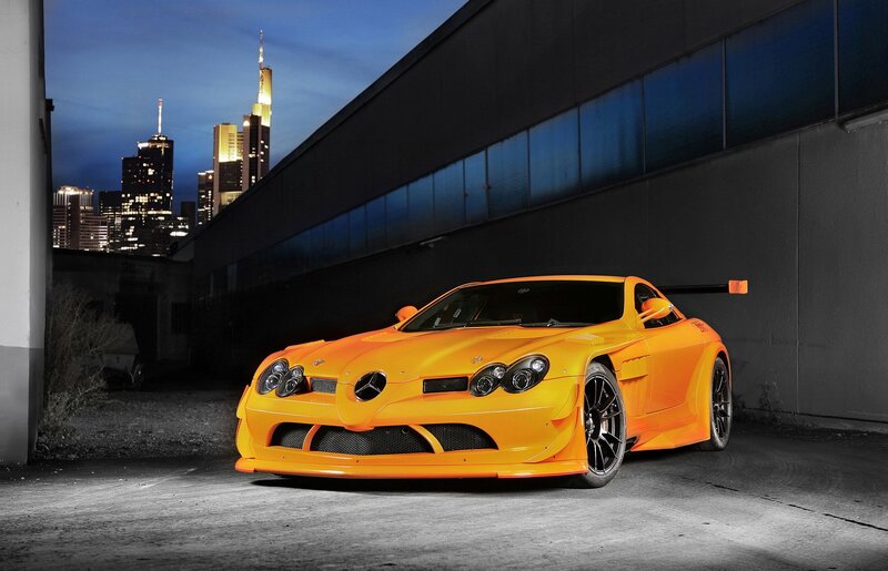 Orange Sports Car — Dramatic, Night, Photograph, City Skyline, Building, Black