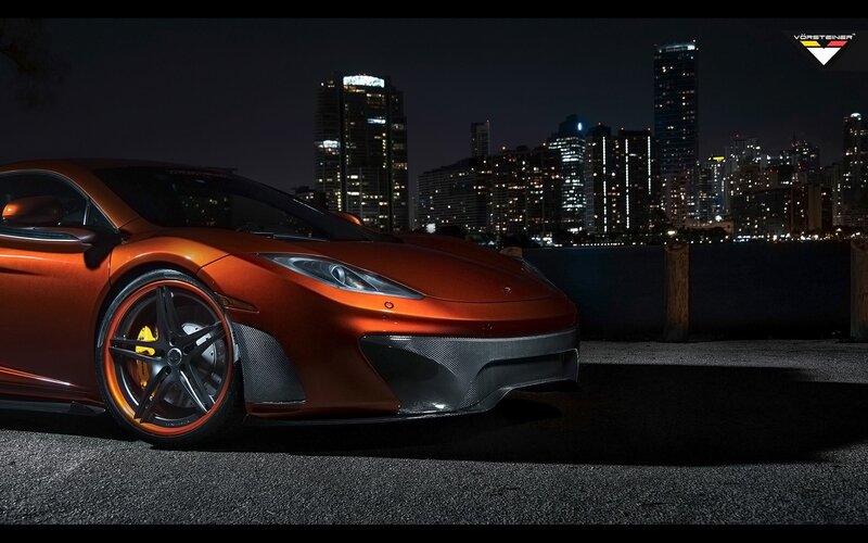Orange Sports Car — Dramatic, Night, Photograph, City Skyline, Buildings