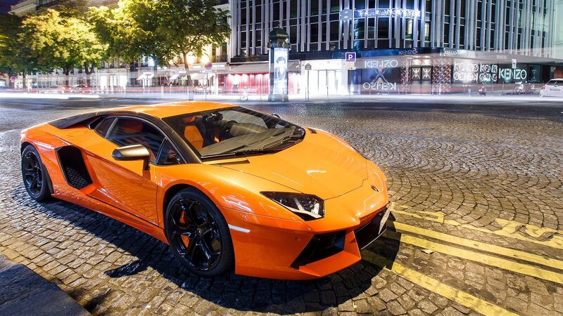 Orange Sports Car — Dramatic, Night, Photograph, Cobblestone Street
