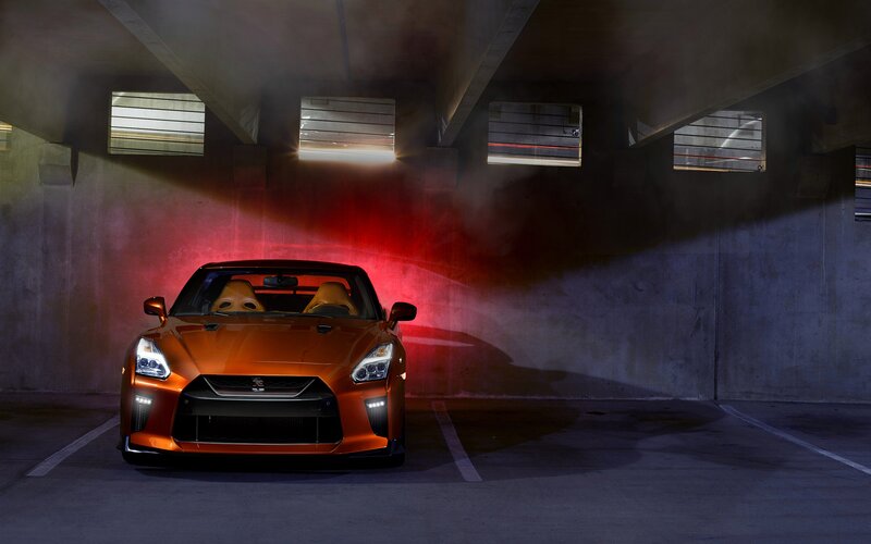 Orange Sports Car — Dramatic, Night, Photograph, Parking Garage, Red Light