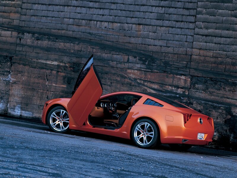 Orange Sports Car — Dramatic, Photograph, Brick Wall, Open Door, Road