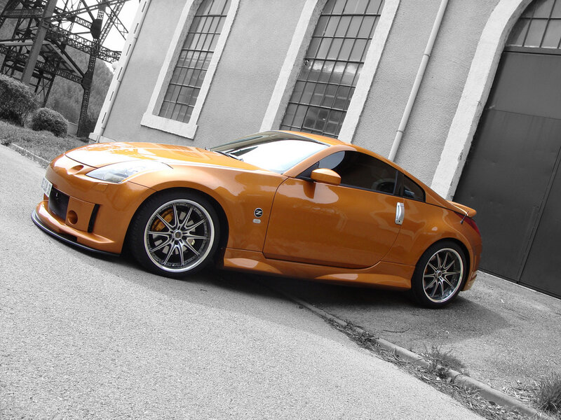 Orange Sports Car — Dramatic, Photograph, Building, Gravel