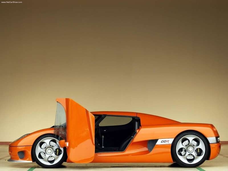 Orange Sports Car — Dramatic, Photograph, Car Door, Wheel, Side Mirror