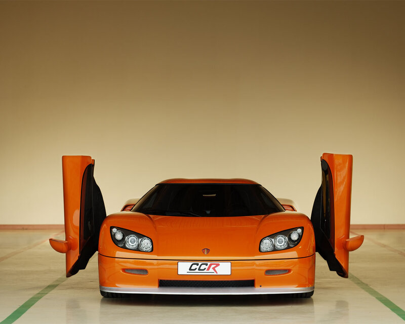Orange Sports Car — Dramatic, Photograph, Car Doors, License Plate, Headlights