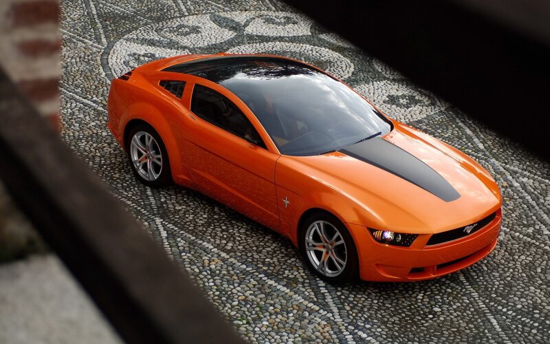 Orange Sports Car — Dramatic, Photograph, Cobblestone, Roof Window