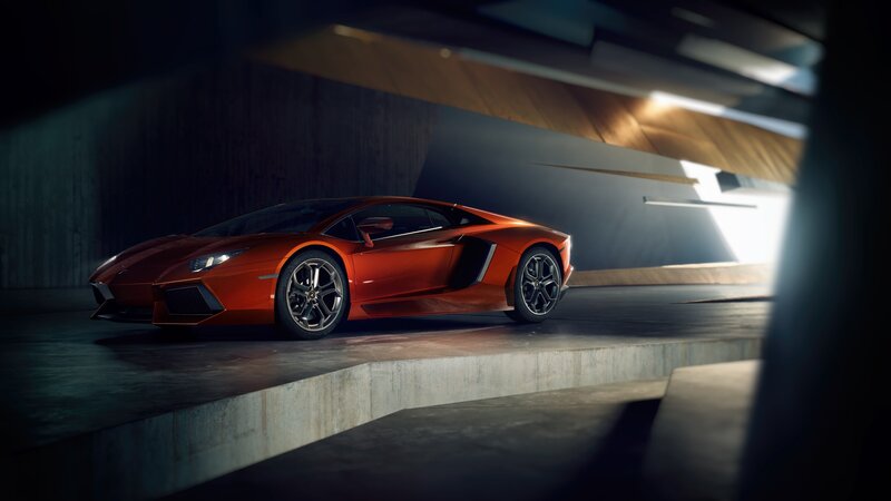 Orange Sports Car — Dramatic, Photograph, Concrete Platform