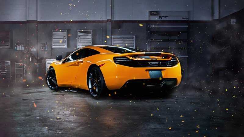 Orange Sports Car — Dramatic, Photograph, Garage, Sparks, Smoke