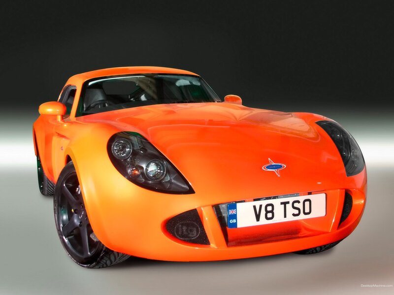 Orange Sports Car — Dramatic, Photograph, License Plate, Headlights, Black