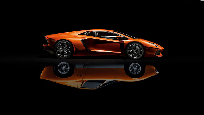 Orange Sports Car — Dramatic, Photograph, Reflection, Black Background