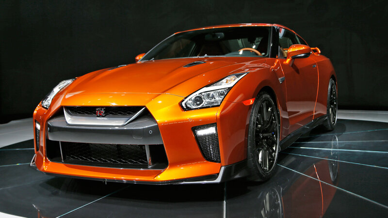 Orange Sports Car — Dramatic, Photograph, Showroom, Black Floor