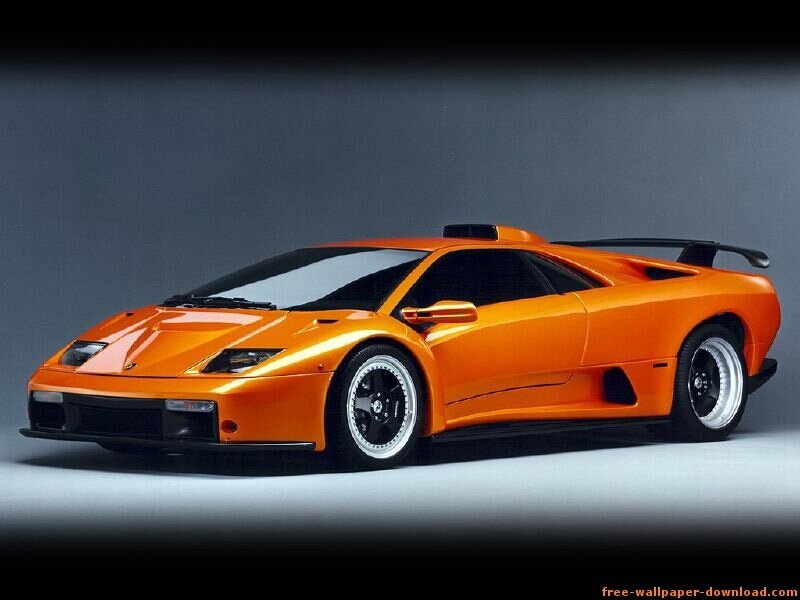 Orange Sports Car — Dramatic, Photograph, Tire, Windshield