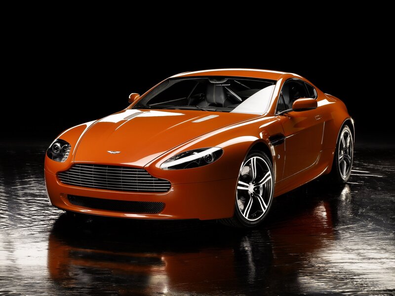 Orange Sports Car — Dramatic, Photograph, Wet Floor, Black Background