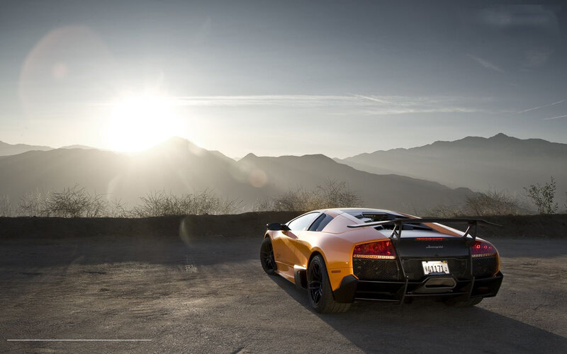 Orange Sports Car — Dramatic, Sunset, Photograph, Mountains