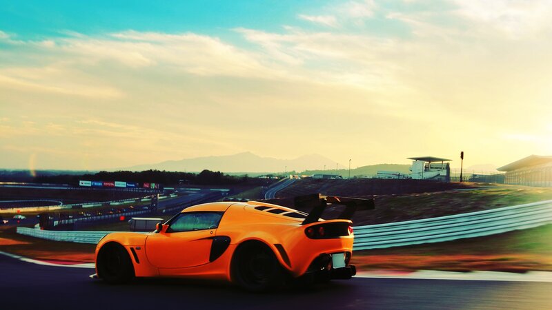 Orange Sports Car — Dramatic, Sunset, Photograph, Race Track, Mountains, Sky