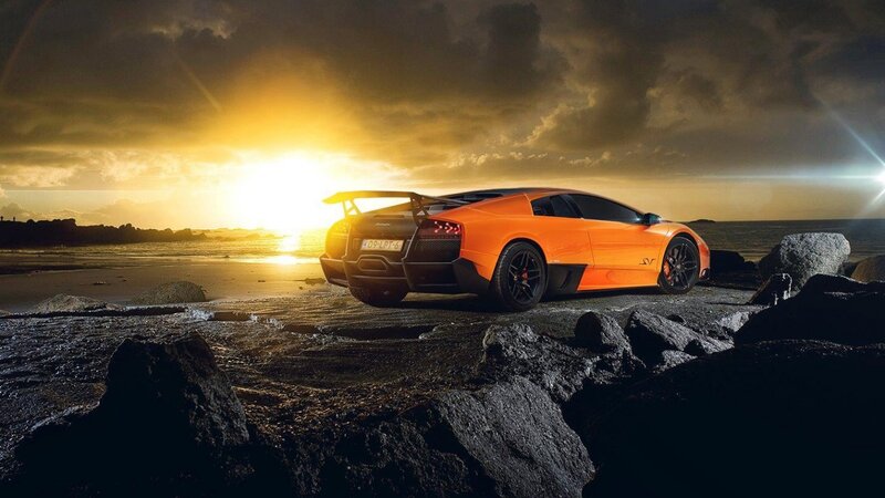 Orange Sports Car — Dramatic, Sunset, Photograph, Rocks