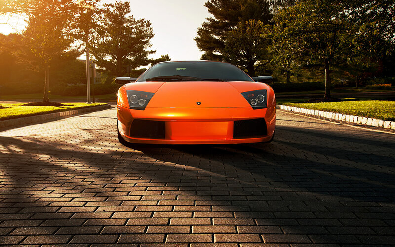 Orange Sports Car — Dramatic, Sunset, Photograph, Trees, Paved Road