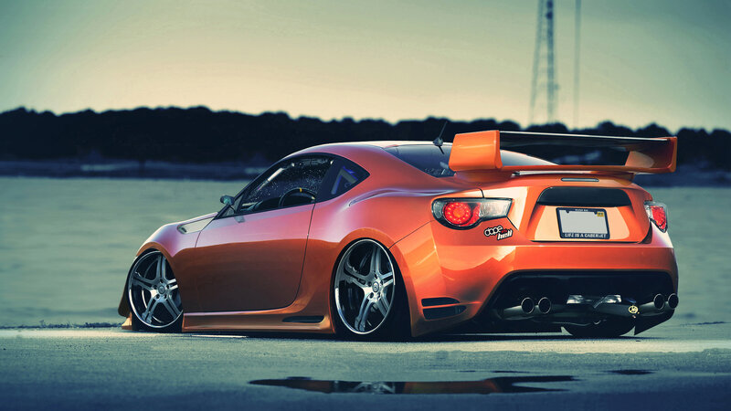 Orange Sports Car — Dramatic, Sunset, Photograph, Wings