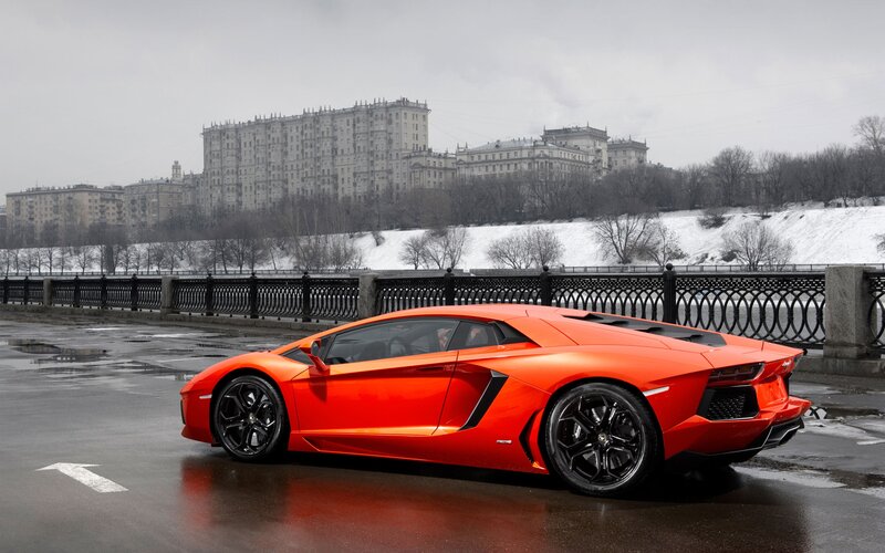 Orange Sports Car — Dramatic, Winter, Photograph, Bridge