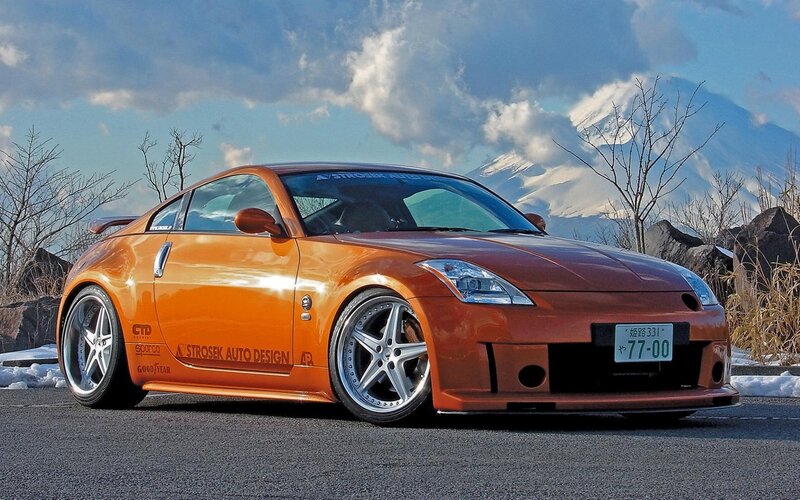 Orange Sports Car — Dramatic, Winter, Photograph, Mountain