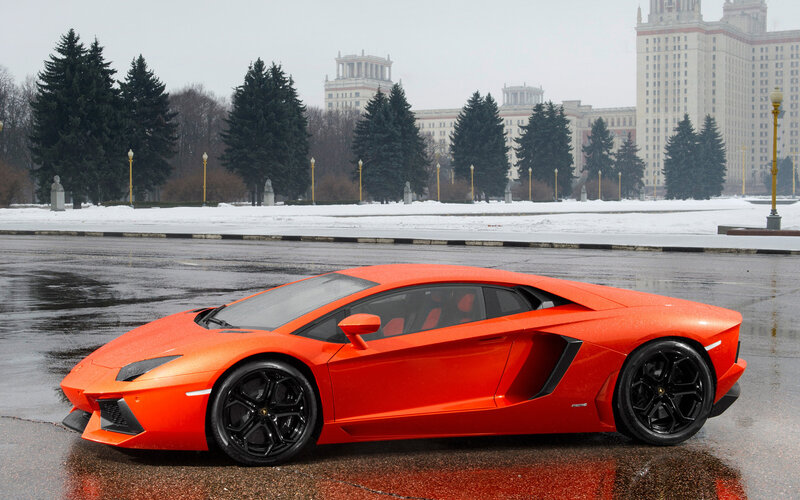 Orange Sports Car — Dramatic, Winter, Photograph, Snow