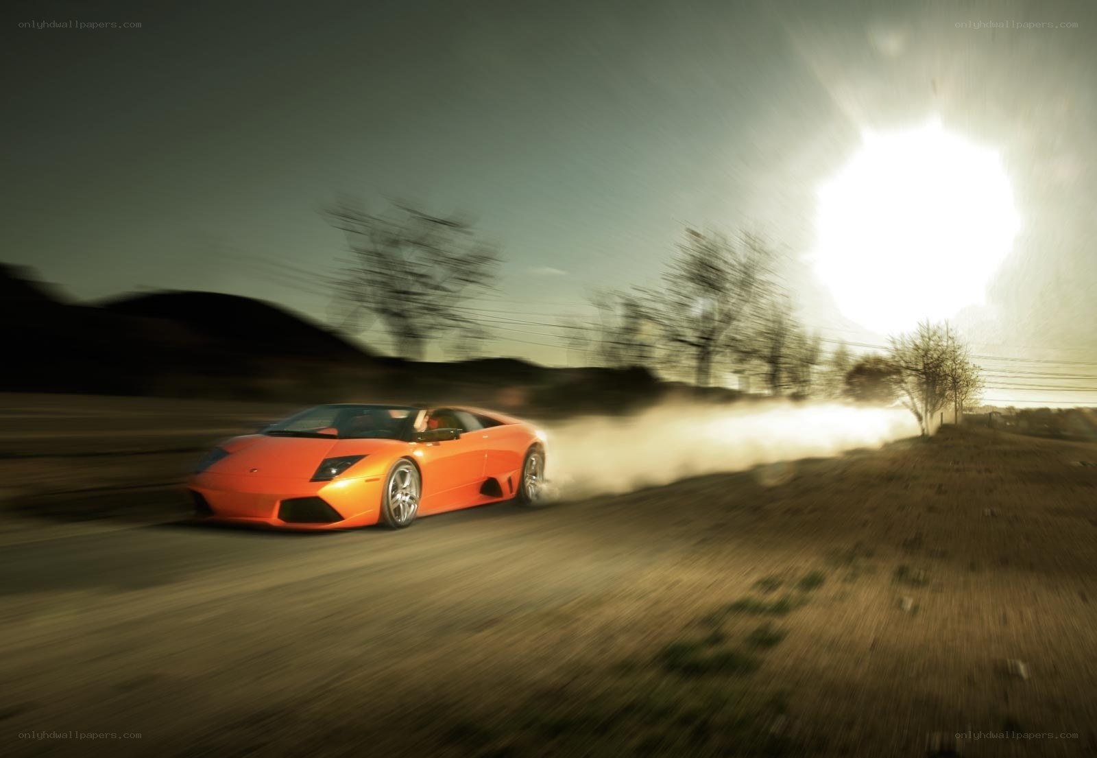Orange sports car drifting