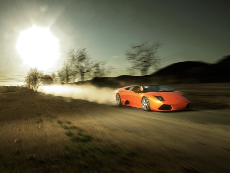 Orange sports car drifting