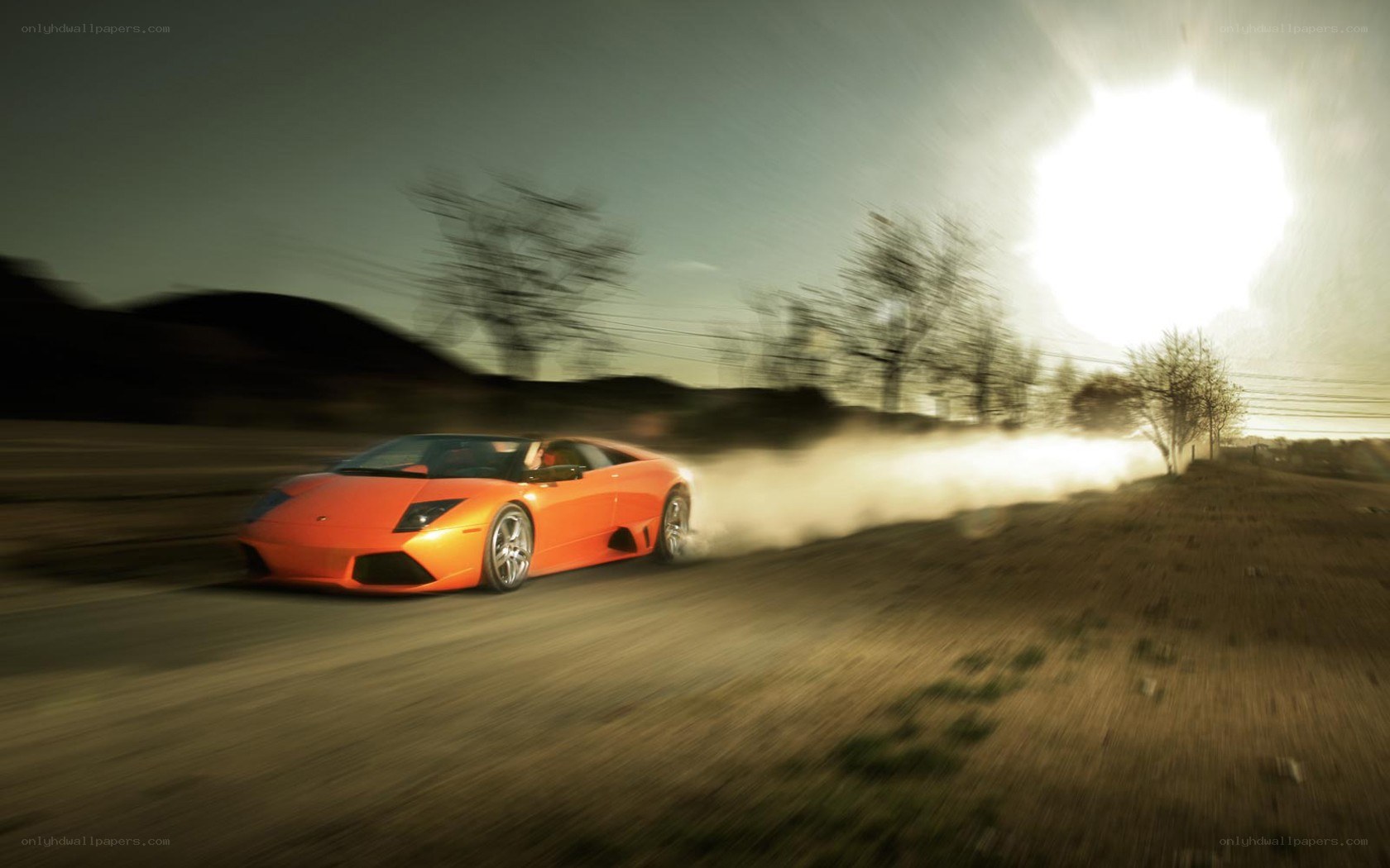 orange sports car drifting