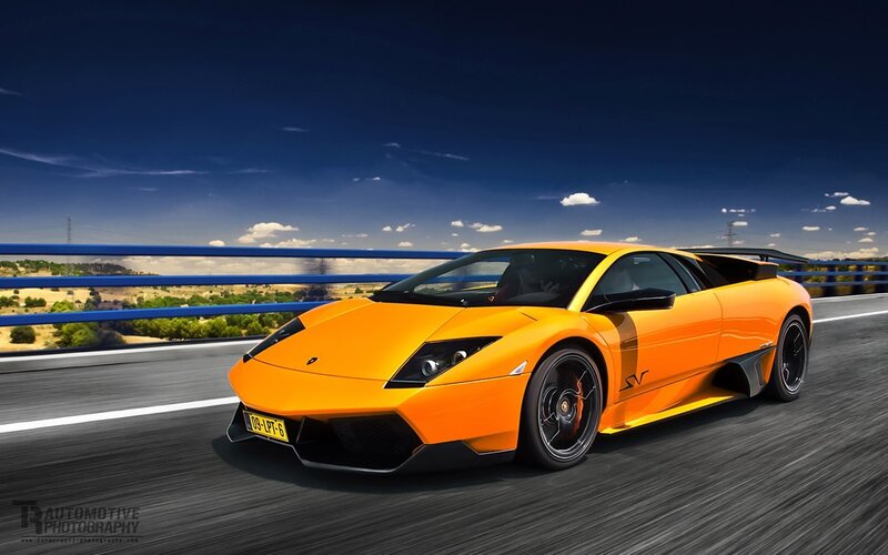 Orange Sports Car — Dynamic, Afternoon, Photograph, Bridge, Road, Sky