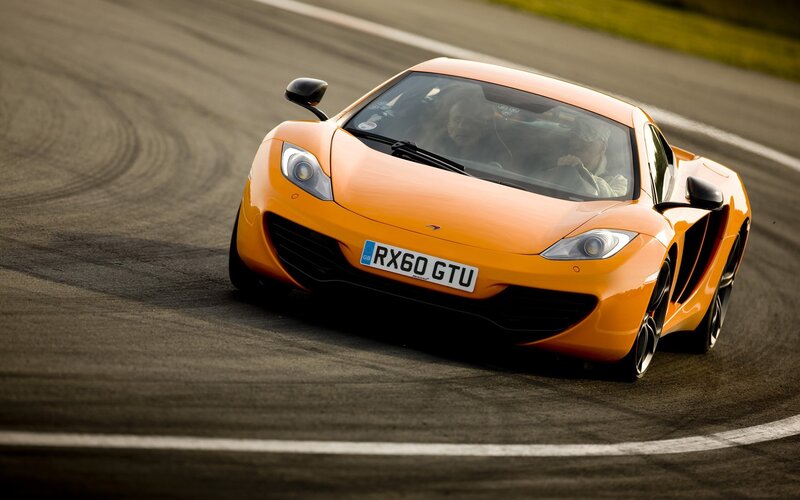 Orange Sports Car — Dynamic, Afternoon, Photograph, Driver, Passenger