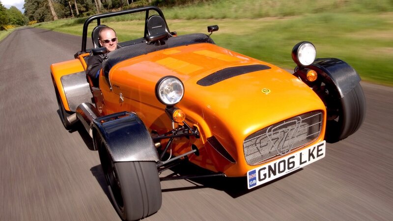 Orange Sports Car — Dynamic, Afternoon, Photograph, Man, Road