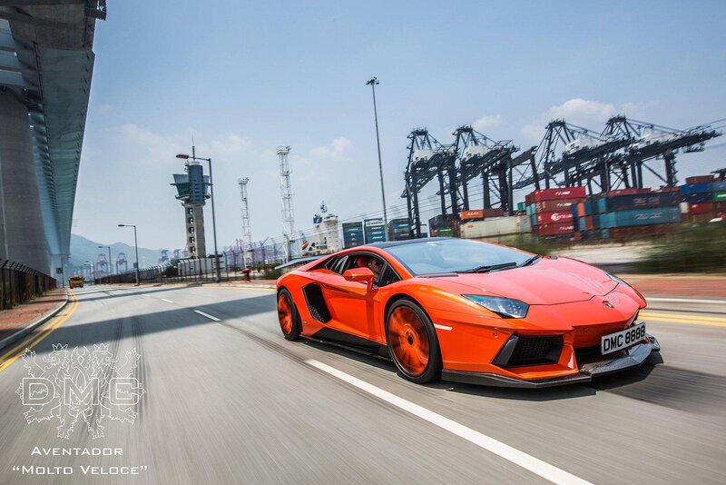 Orange Sports Car — Dynamic, Afternoon, Photograph, Road, Container Cranes