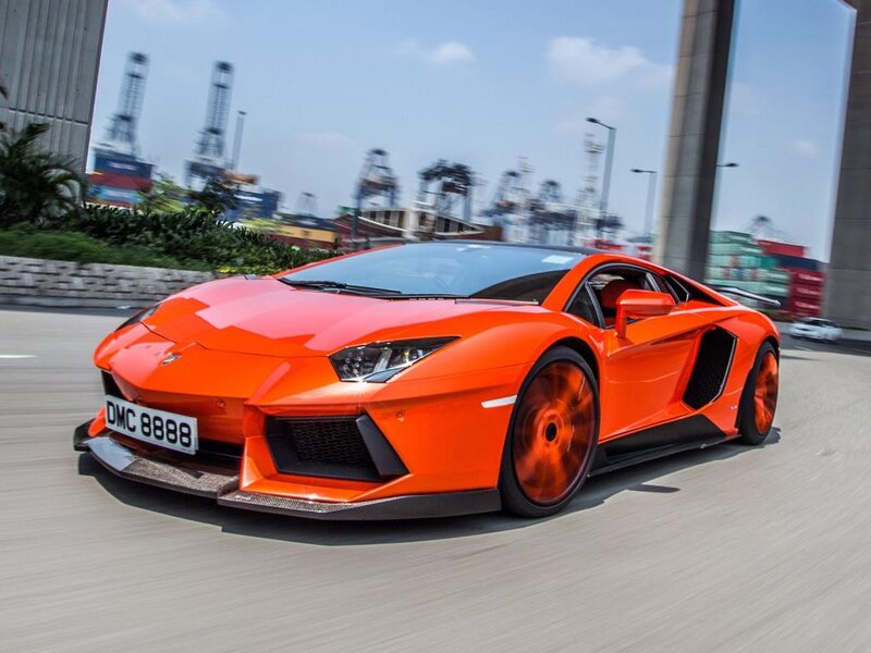 Orange Sports Car — Dynamic, Afternoon, Photograph, Road, Cranes
