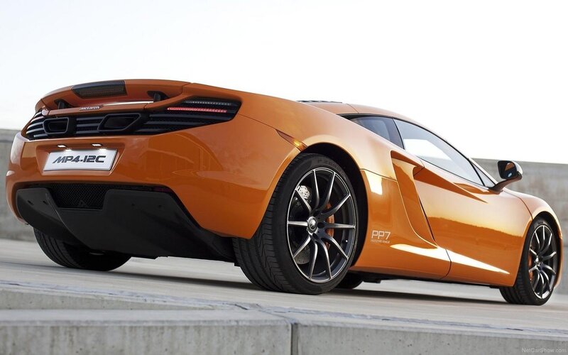 Orange Sports Car — Dynamic, Afternoon, Photograph, Tire