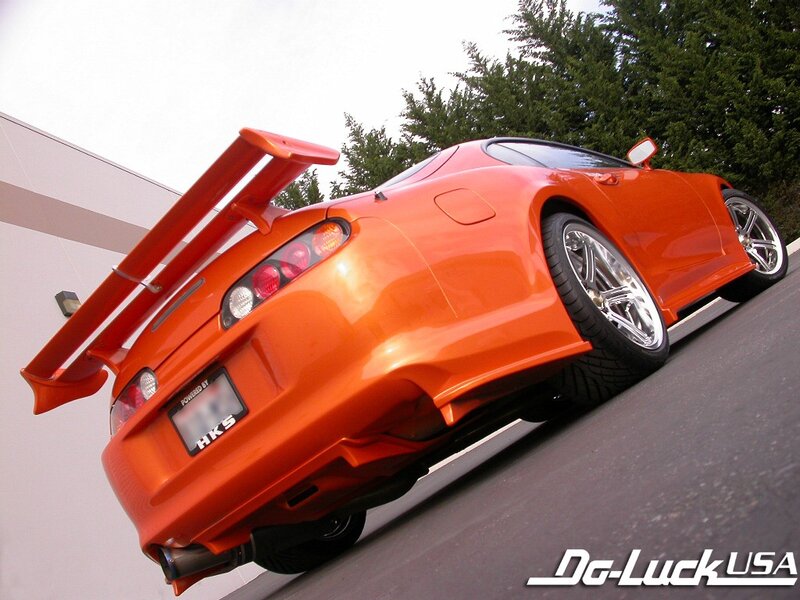 Orange Sports Car — Dynamic, Afternoon, Photograph, Trees, Building