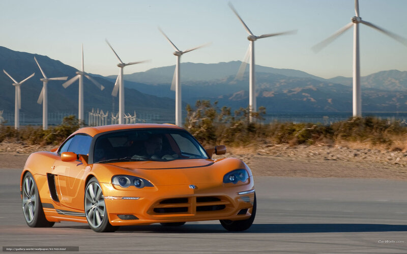 Orange Sports Car — Dynamic, Afternoon, Photograph, Wind Turbines