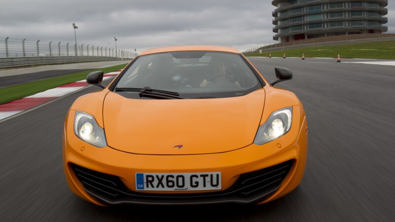 Orange Sports Car — Dynamic, Photograph, Race Track, Driver, Building