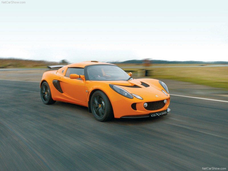 Orange Sports Car — Dynamic, Photograph, Race Track, Sky