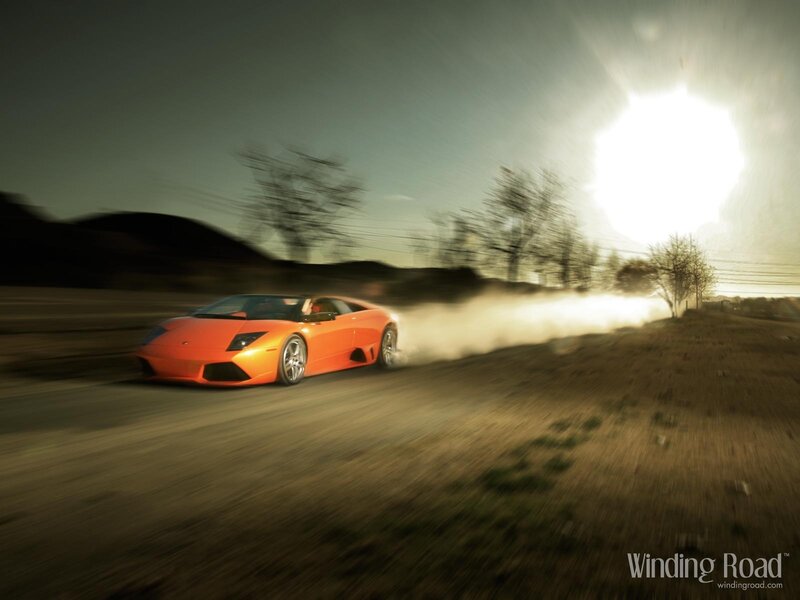 Orange Sports Car — Dynamic, Sunset, Photograph, Dust