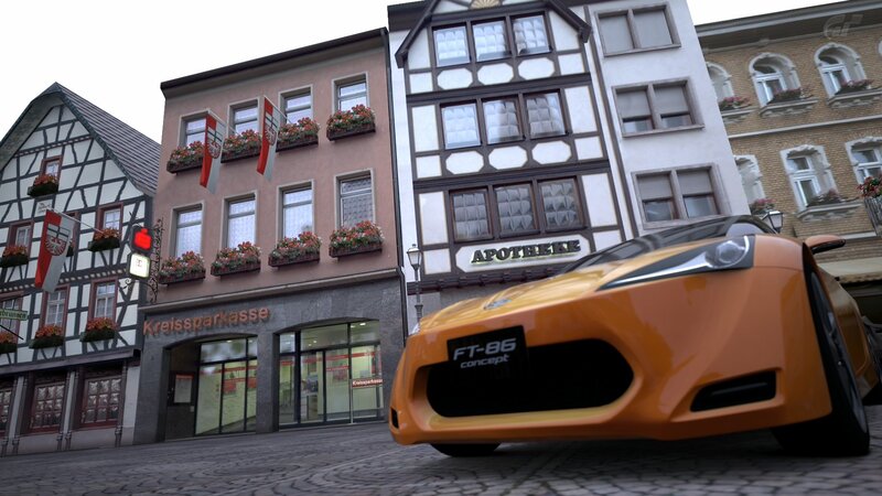 Orange sports car in a town