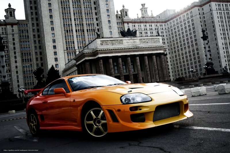 Orange sports car in city