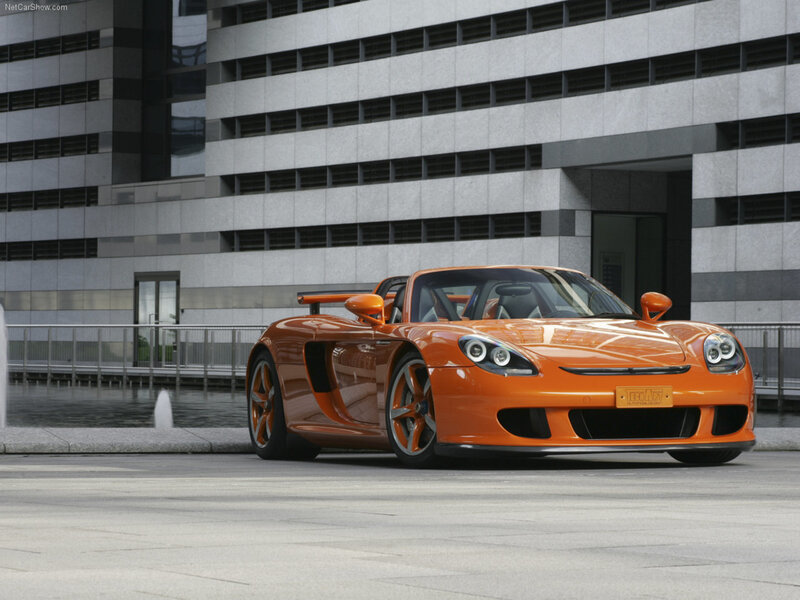 orange sports car in city