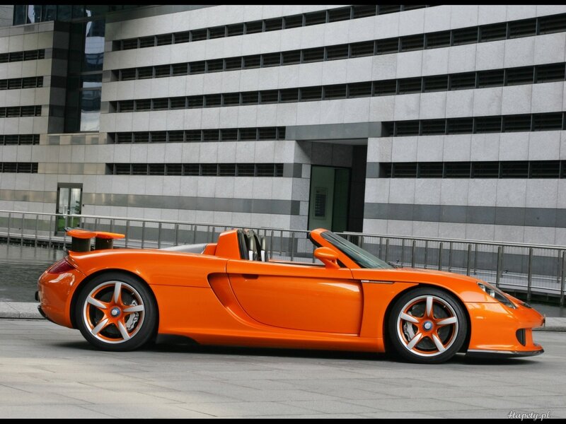orange sports car in city