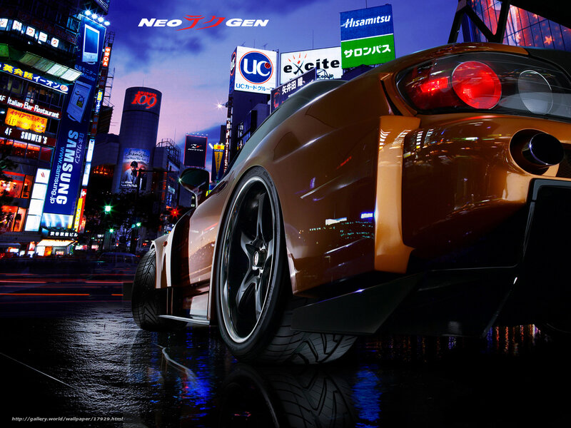 Orange sports car in city at night