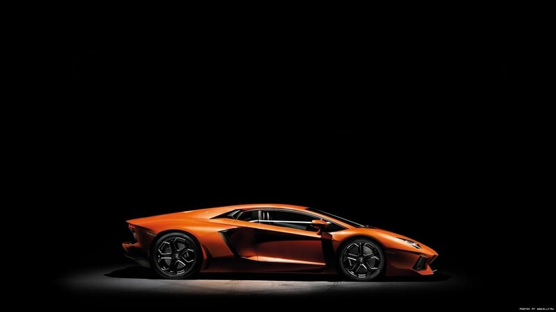 orange sports car in dark