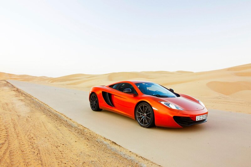 Orange sports car in desert