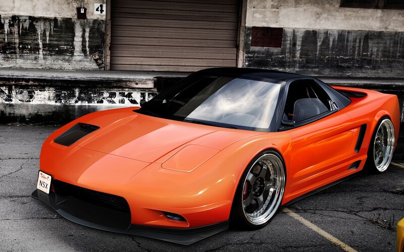 Orange sports car in garage