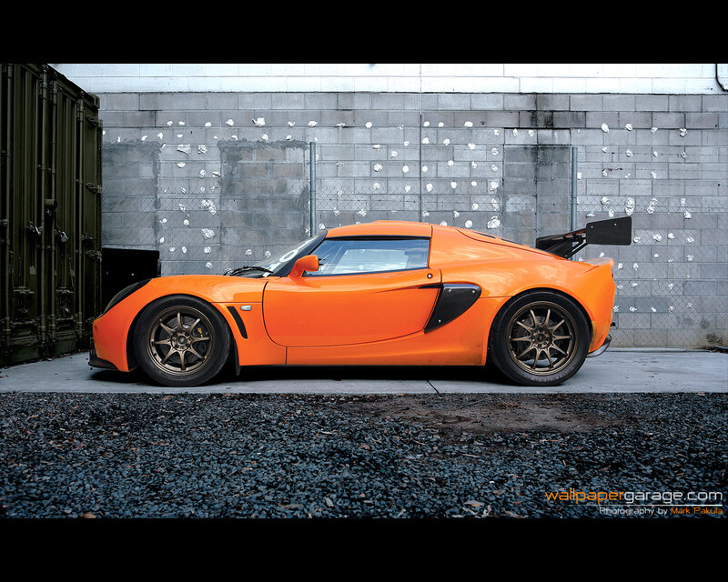 Orange sports car in garage