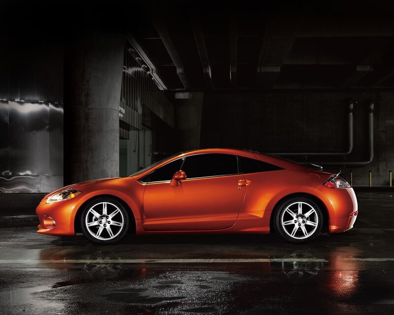 Orange sports car in garage