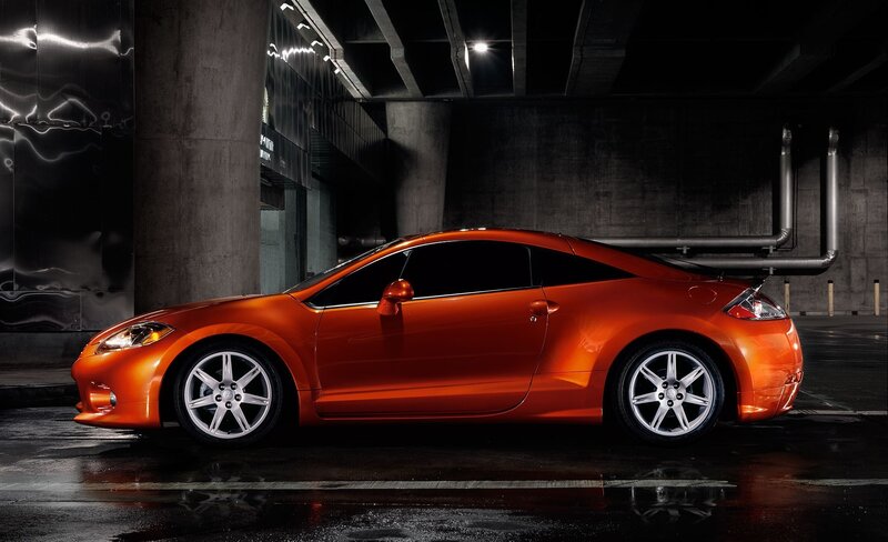 Orange sports car in garage