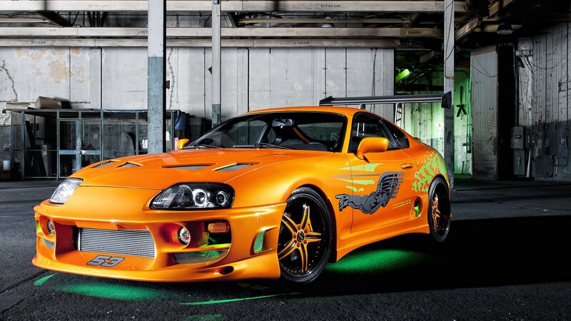 orange sports car in garage
